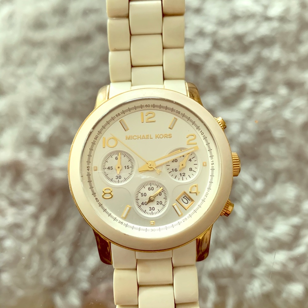 Michael Kors woman’s watch off white, gold trim.